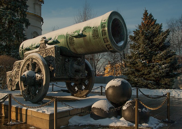 Image of a large, ornate cannon, half-covered in snow, on a pedestal, with a small pile of very large cannonballs in front of it. This is a representation of overkill per the Therapeutic Order, if a lesser force is needed.